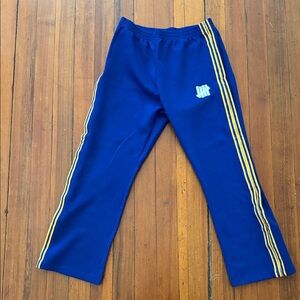Undefeated Blue Joggers with Yellow Stripes